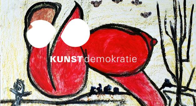eine rote Fantasiefigur, inder steht geschrieben KUNSTdemokratie und zwei herzähnliche große weiße Flecken wie Augen.