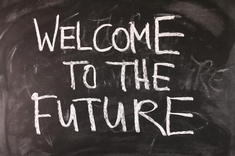 Blackboard saying "Welcome to the Future" written with chalk