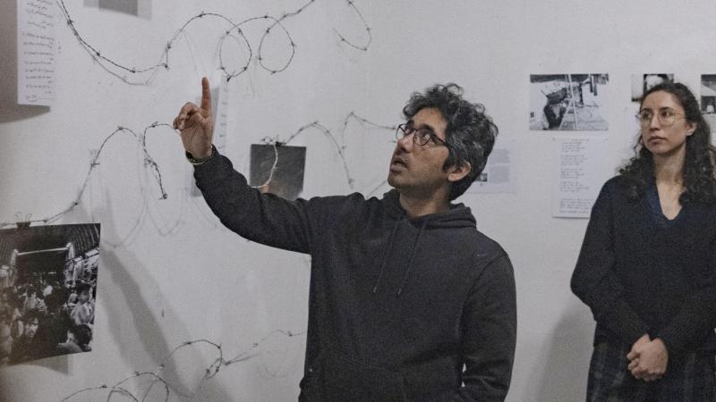 ?Whyborders initiator Arash Hampay guides through the exhibition in March 2023.