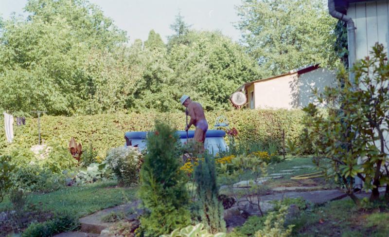 photograph of man in garden