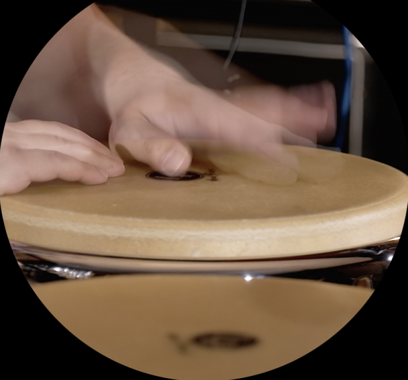 Hands tapping on a drum 