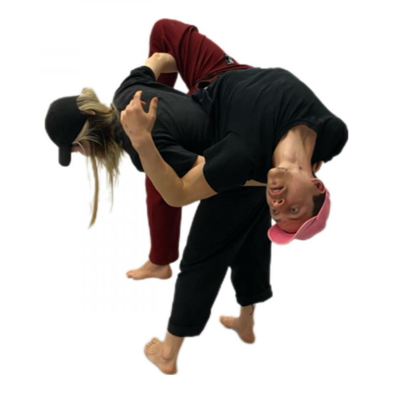 one person lifting the other one with her back in a white background