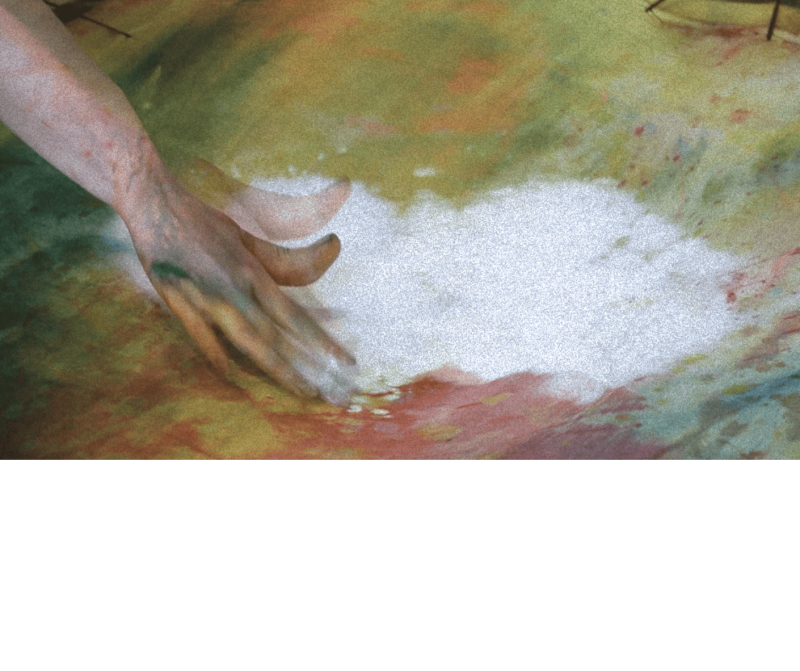 A distorted photo of a painting hand