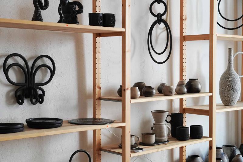 Shelves with Violaine Toth's black and white ceramics displayed
