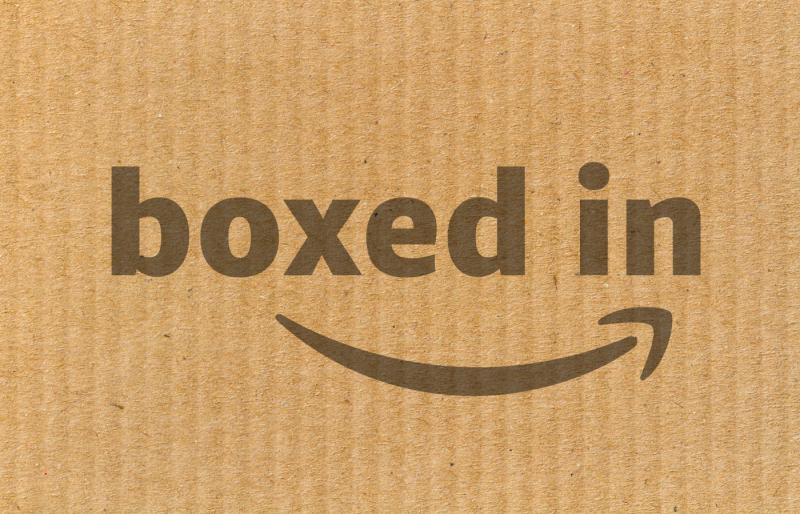 A cardboard box with the Boxed In exhibition logo