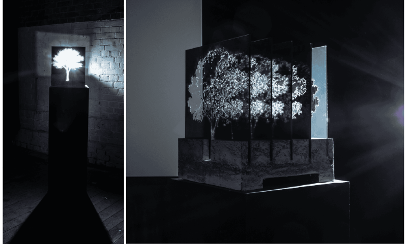 Physical sculpture made of concrete and acrylic, illuminated to reveal its solid form and internal cut-out shape.