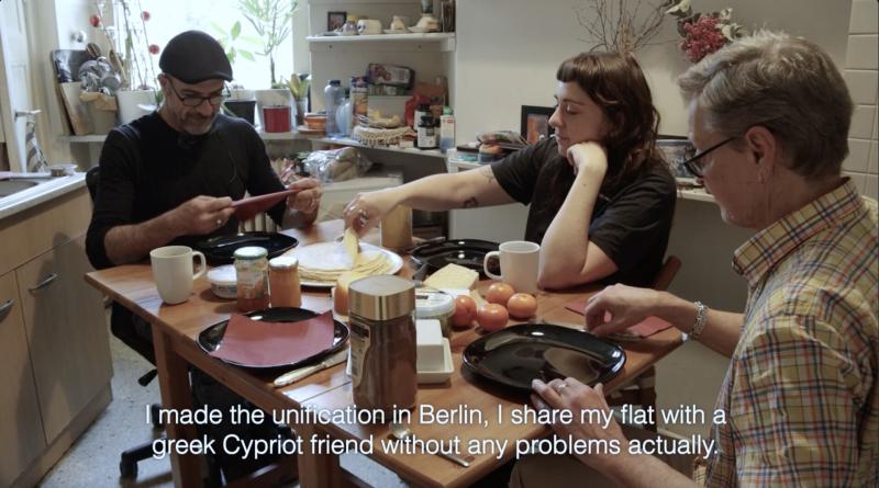 Three people are having breakfast.