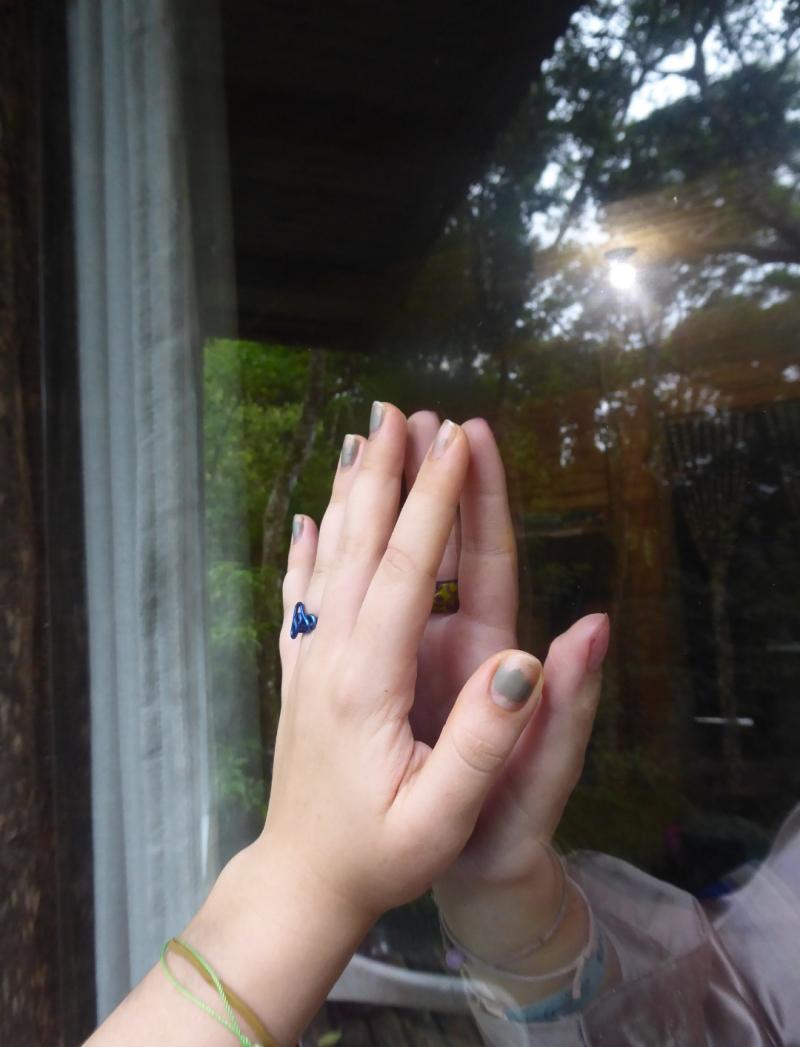 Hands touching glass in the middle 