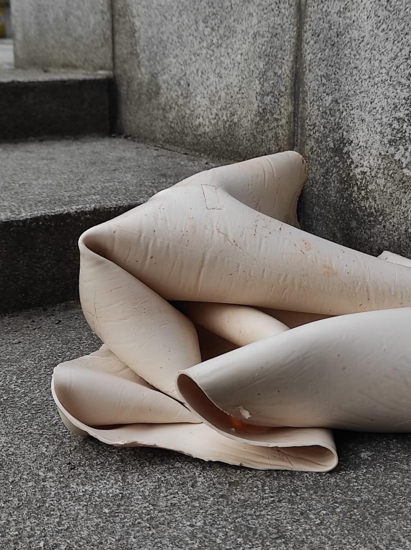Beige Silicone - skin like sheet folded on the floor.
