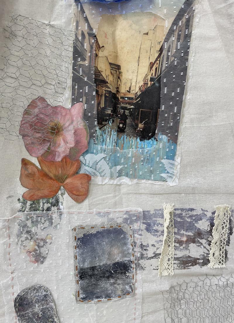 a collage of painting and photos sewed on textile