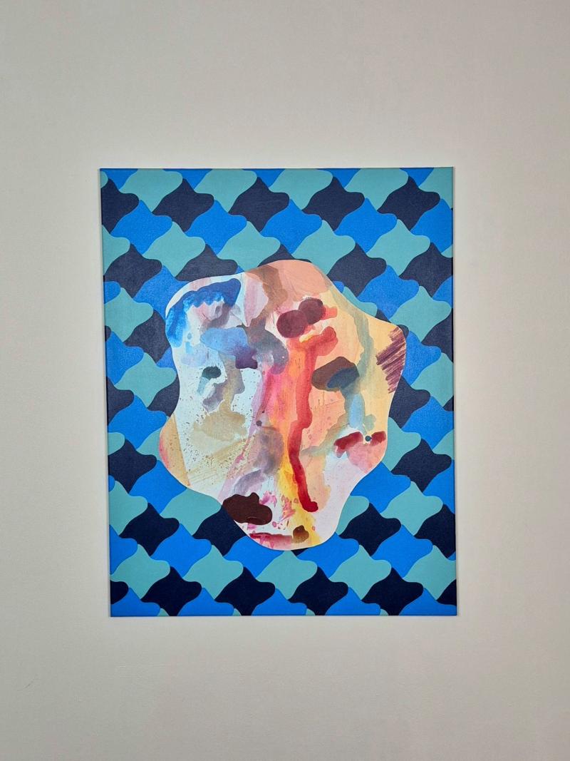 Abstract painting with a blue repeating pattern background and a fluid, multicolored organic shape in the center resembling a sea organism.