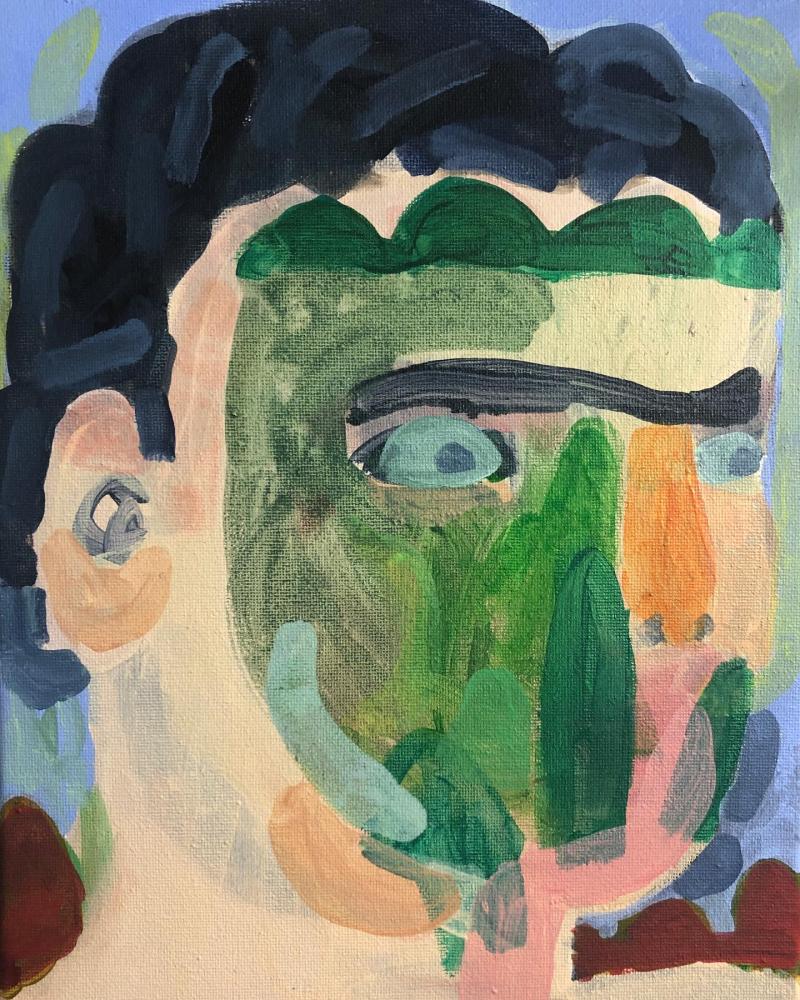 A head of a person with colourful pieces sticking on to their face. 